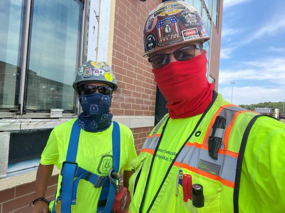 Carpenters on job wearing masks